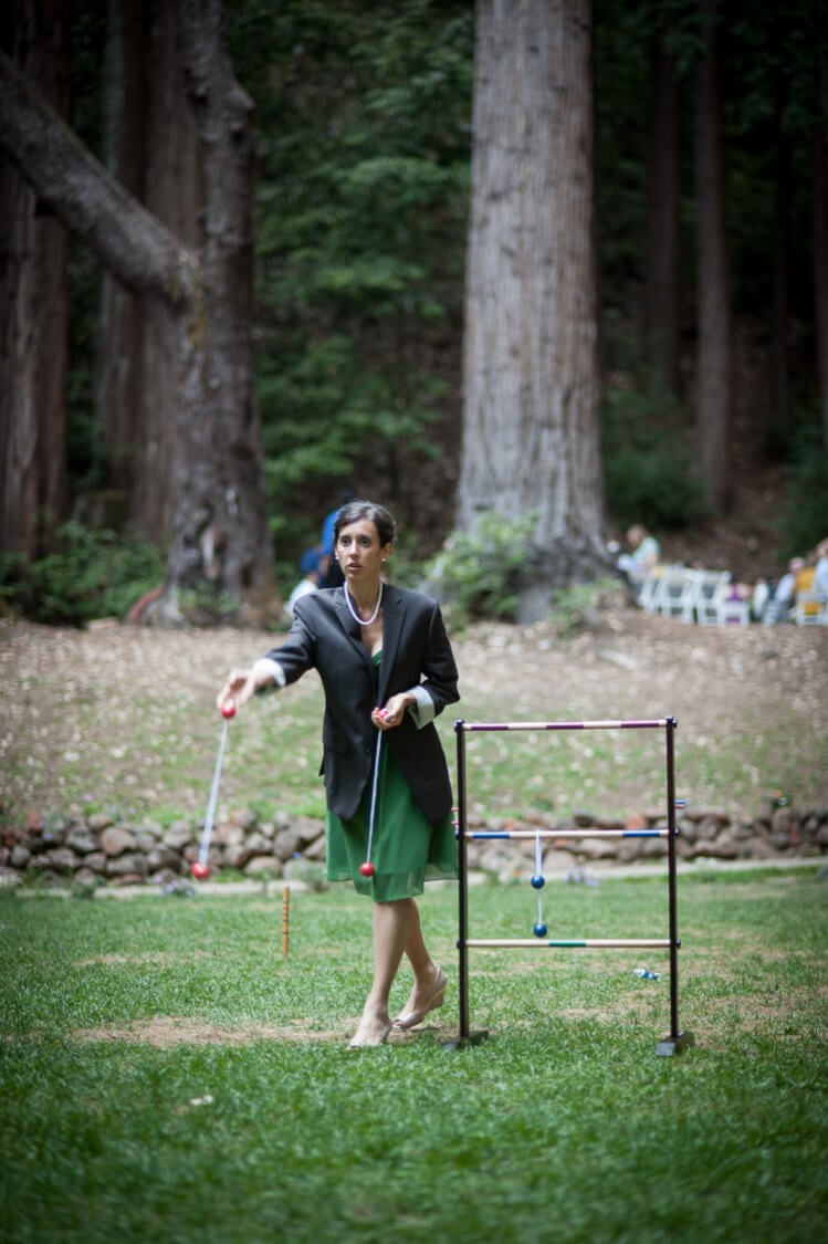 wedding guest playing ladder golf game