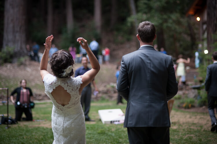 Bride and groom playing an outdoor game