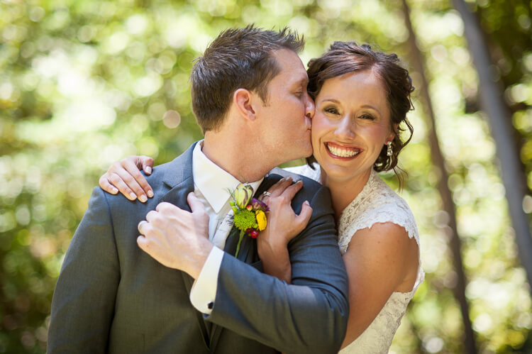 A groom kissing his bride