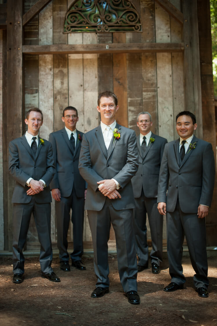 A groom and his groomsmen posing for the camera