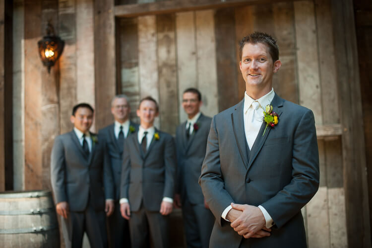 A groom and his groomsmen posing for the camera