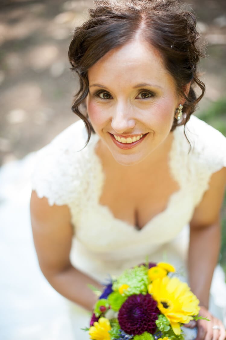 A bride smiling at the camera