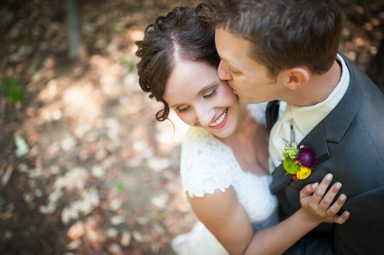 A groom kissing his bride