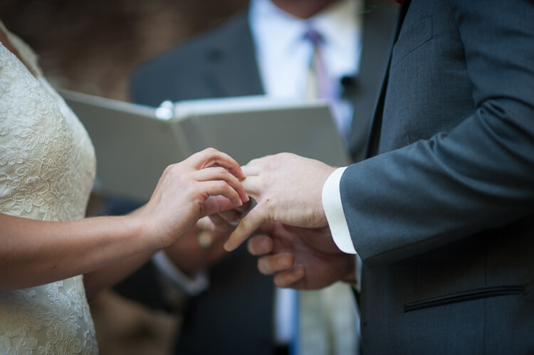 A bride and groom exchanging rings