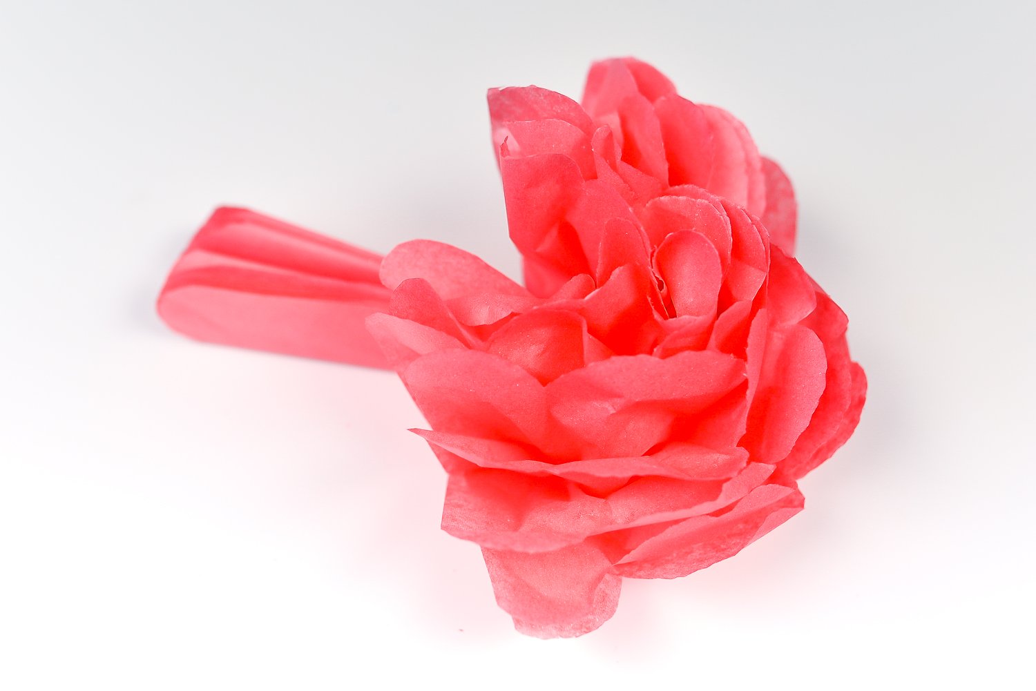 How to Make Tissue Paper Flowers: Carefully start to separate the layers of the flower.