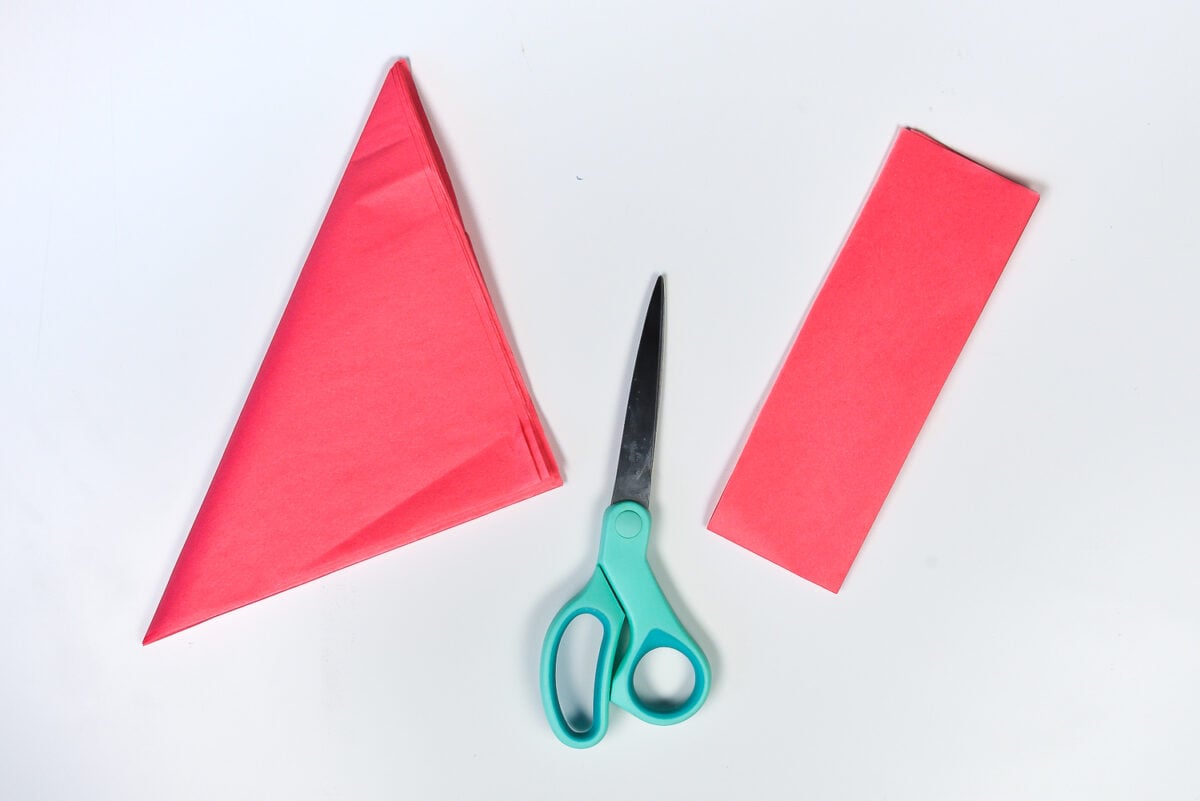 How to Make Tissue Paper Flowers: Cut off the extra part of the folded piece of tissue paper