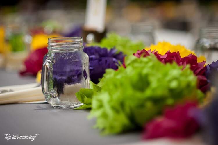 up close view of tissue paper flowers on as wedding centerpiece