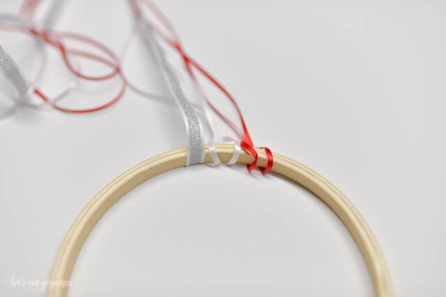 patriotic windsock tutorial - red and white ribbon attached to embroidery hoop