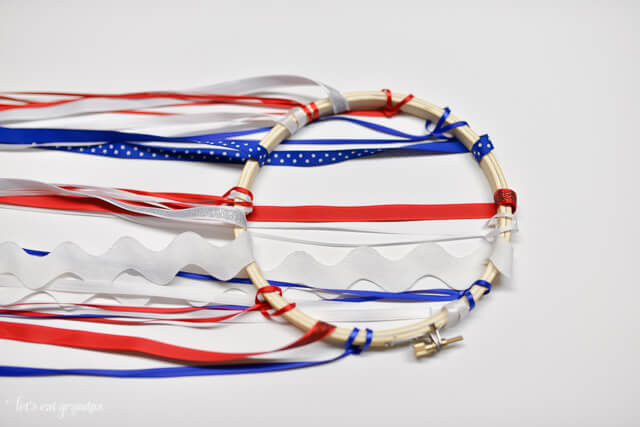 patriotic windsock tutorial - red, white, and blue ribbon attached to embroidery hoop