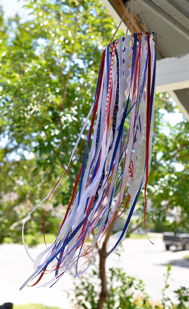 finished patriotic windsock hanging from house outside