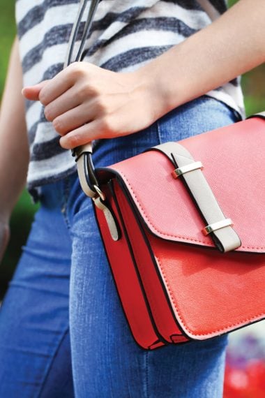 Clean out and organize your purse with these seven tips for carrying less in your bag.