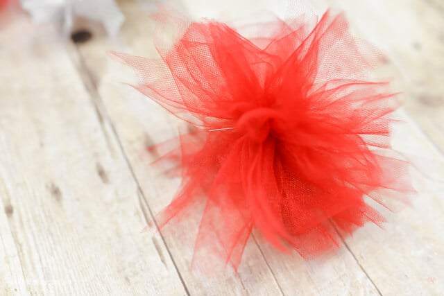 closeup of red firework poof from tulle