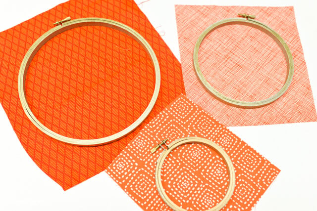 embroidery hoops on orange pumpkin fabric