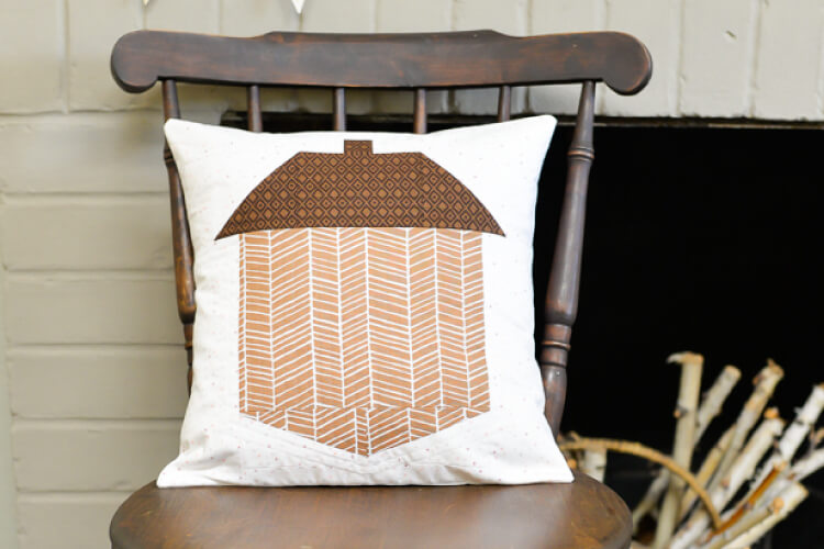 acorn quilt block pillow on rocking chair