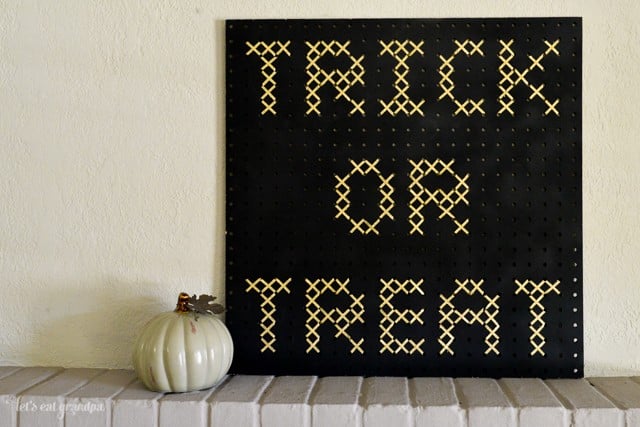 Make this giant cross stitch using a pegboard and ribbon!