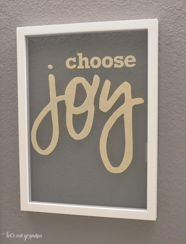 Choose joy floating artwork on wall