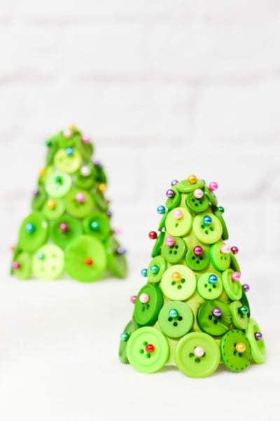 Buttons, straight pins, and foam cone equal an adorable and easy Christmas tree! A fun craft project to make your holidays special.