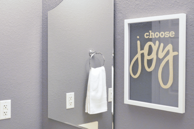 Choose joy floating artwork in bathroom
