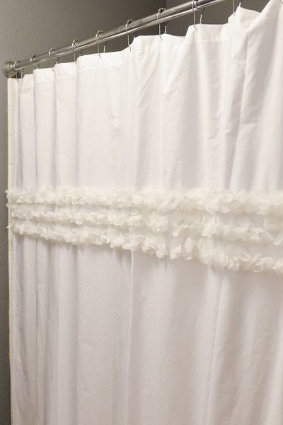 How to make a custom shower curtain using a flat sheet and an old shower curtain as a template -- then embellish as desired!