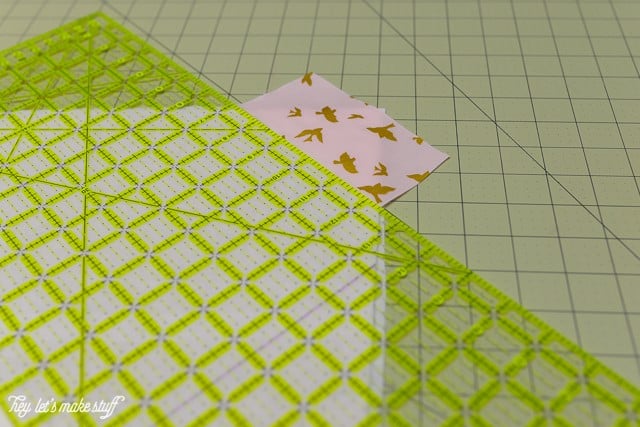 sewing ruler and fabric on sewing mat