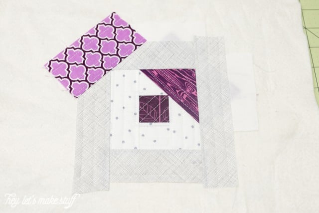 Pieces of fabric arranged into a quilt block