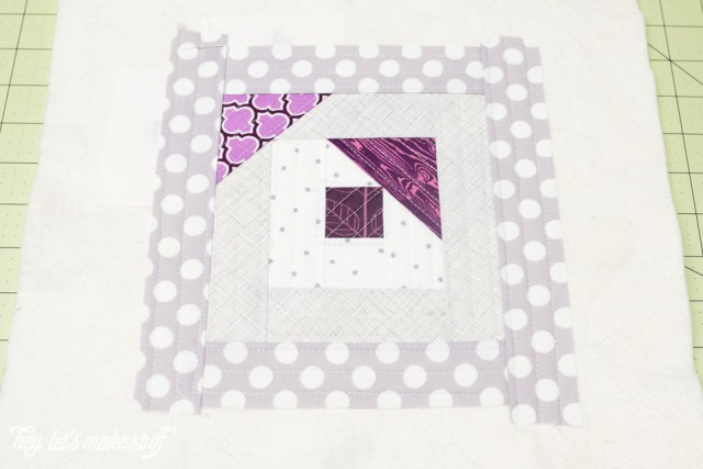 Pieces of fabric arranged into a quilt block