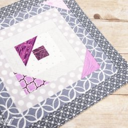 Using the quilt-as-you-go (QAYG) method, it's easy to make this modified log cabin block. This easy quilting tutorial is a fun take on a classic design.