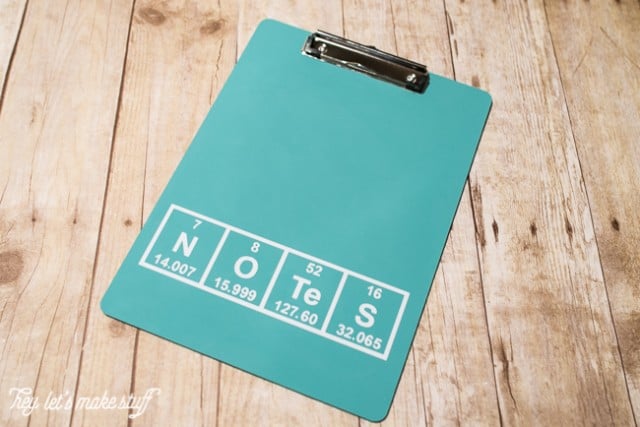 DIY periodic table clipboard on wooden background