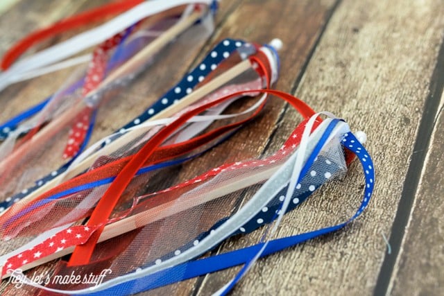 finished red, white and blue DIY patriotic streamers on wood