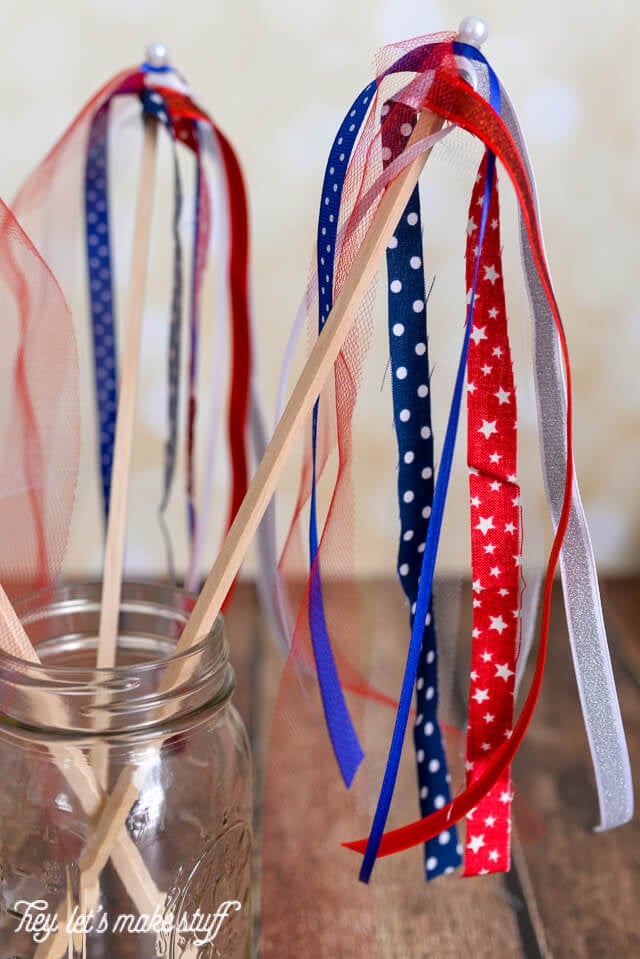 side view of finished red, white and blue DIY patriotic streamers in mason jar