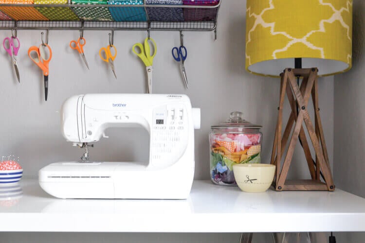 sewing machine on table in colorful craft room