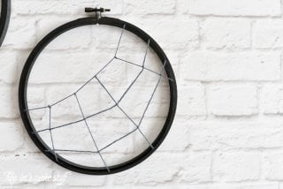 Turn some simple craft supplies into spooky Halloween spider hoops!