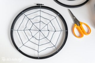 Turn some simple craft supplies into spooky Halloween spider hoops!