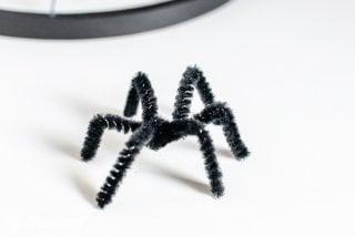 Turn some simple craft supplies into spooky Halloween spider hoops!