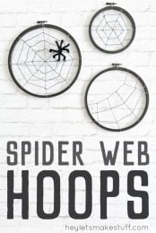 Turn some simple craft supplies—yarn and an embroidery hoop—into spooky Halloween spider hoops!