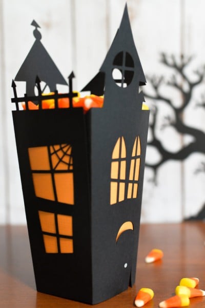Using your Cricut or other cutting machine, make this fun Halloween haunted house candy box! Includes free cut files!