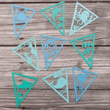These Under The Sea pennants are perfect for baby shower decor or nursery decor. Get the SVG cut files and use your Cricut or other cutting machine to make them!