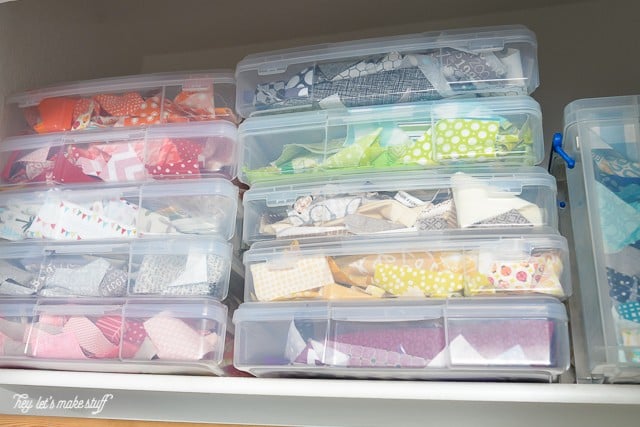 Boxes on a shelf filled with crafting items