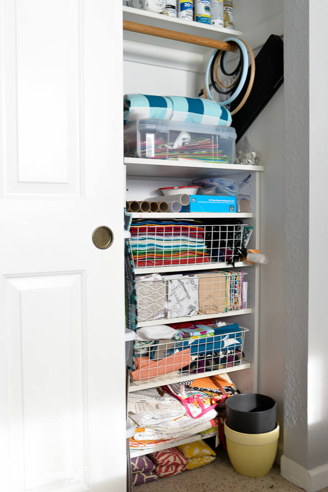 A closet with wire crates filled with crating items