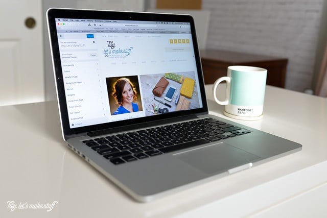 laptop computer with coffee mug on desk