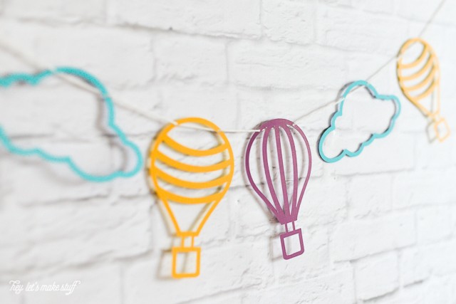 hot air balloon cut files strung on wall