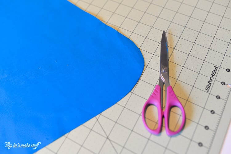 scissors and fabric on sewing table