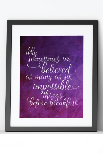 A close up of a sign that is in a black frame with a white mat and the quote, "Why Sometimes I've Believed as Many as Six Impossible Things Before Breakfast"