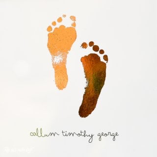 Image of a baby's footprints and personalized with first, middle and last name