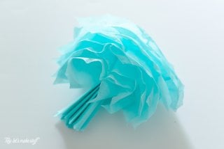 These tissue paper jellyfish are perfect for a mermaid birthday, under the sea party, or any other beachy event you might have!