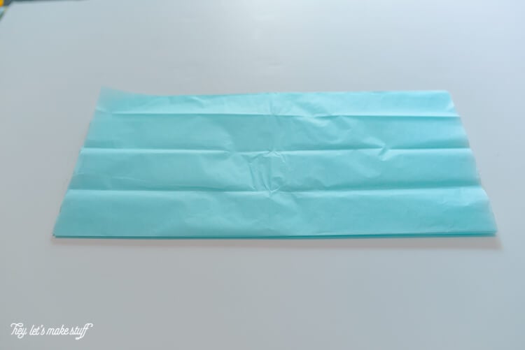Blue tissue paper folded accordion style