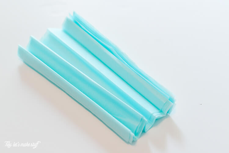 Blue tissue paper folded accordion style