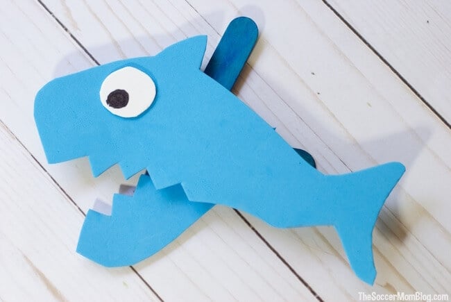 A shark image cut from paper and made into a puppet