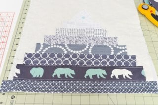 This Bear Mountain quilt-as-you-go (QAYG) block is a fun quilt block perfect for a mountain nursery or any woodland decor!