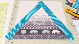 This Bear Mountain quilt-as-you-go (QAYG) block is a fun quilt block perfect for a mountain nursery or any woodland decor!